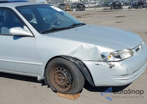 2000 Toyota Corolla Le из США, поврежденный, VIN 1NXBR12E4YZ325974